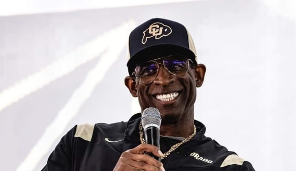 Deion Sanders smiling at CU's kickoff luncheon on Aug. 25